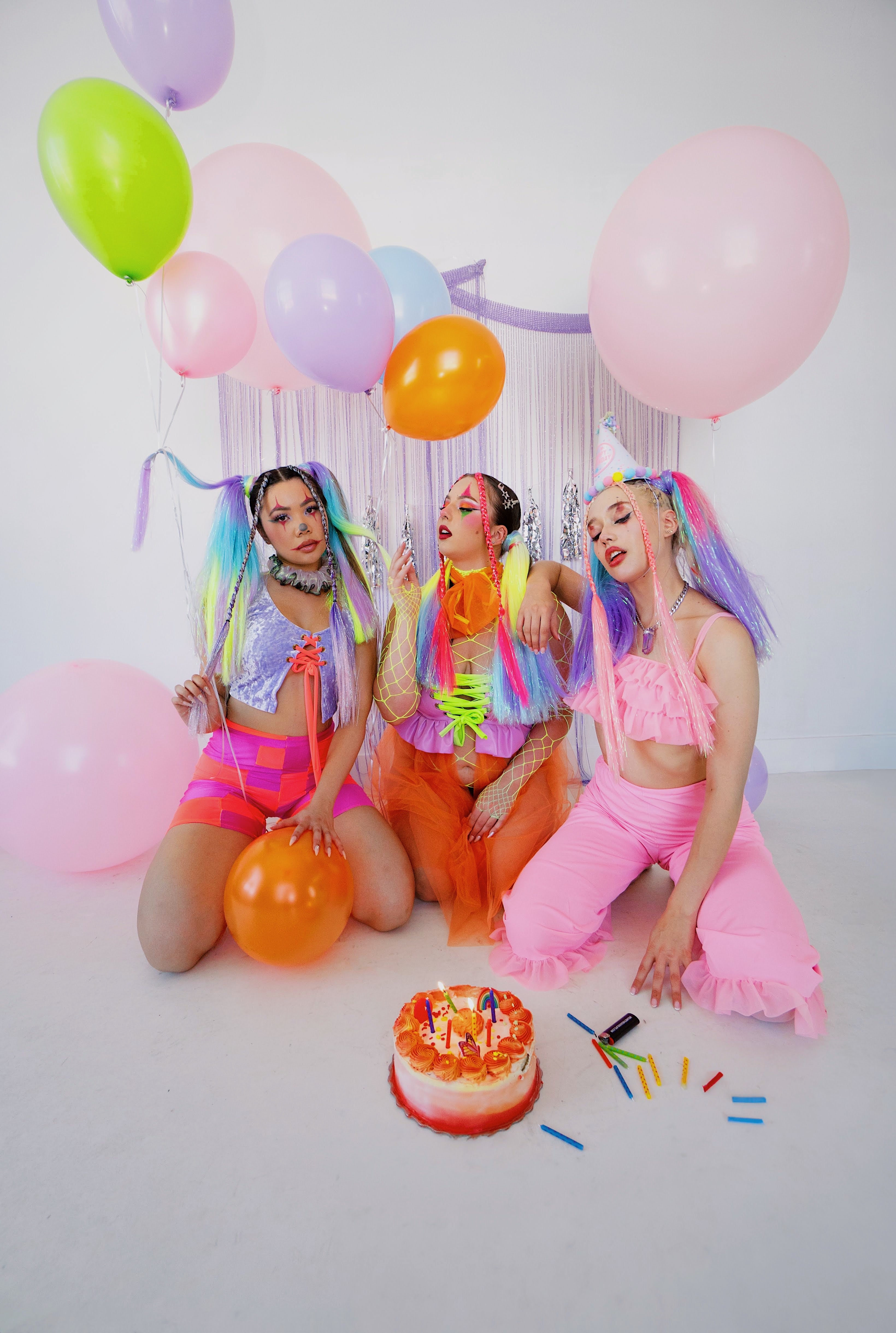 3 Ravers in birthday theme outfits