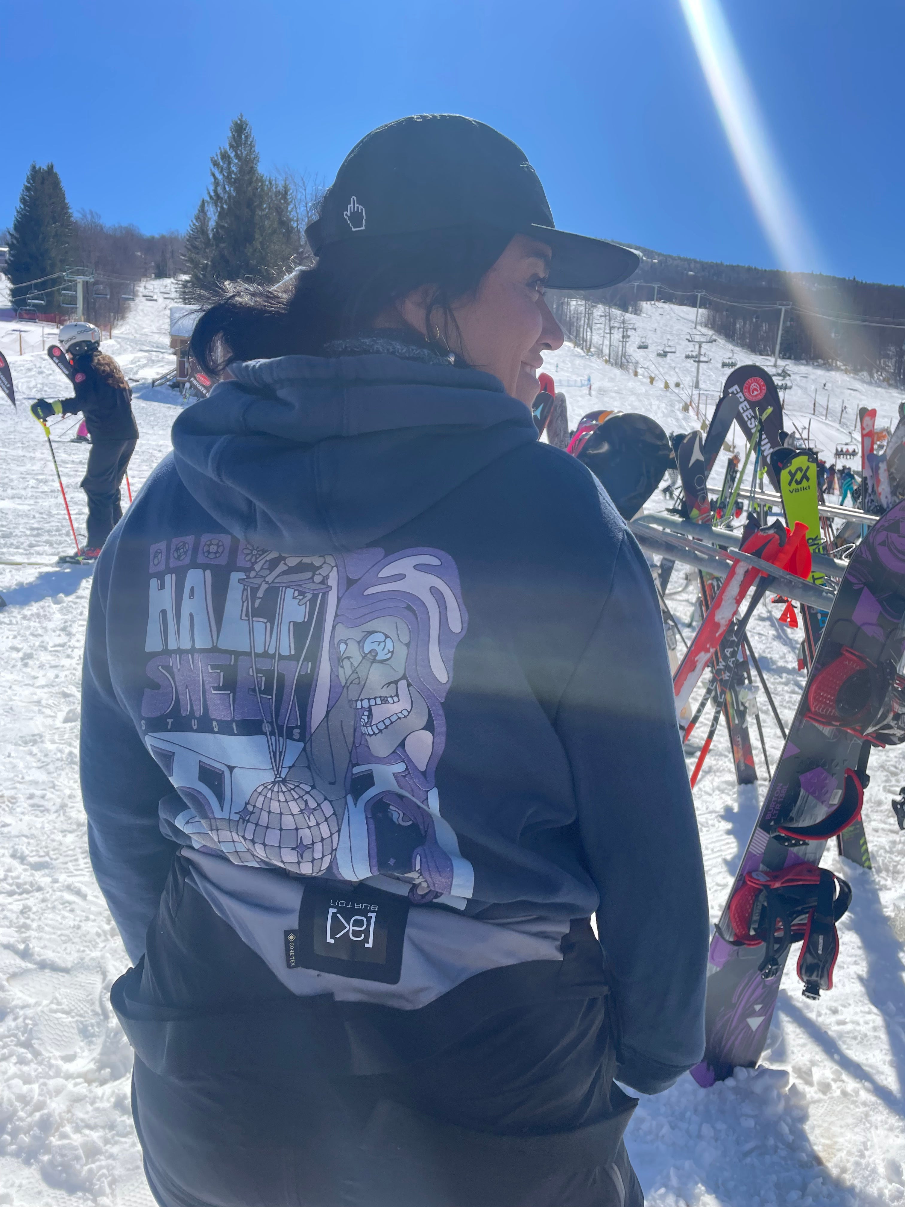 Woman wearing Puppetmaster Hoodie at ski mountain